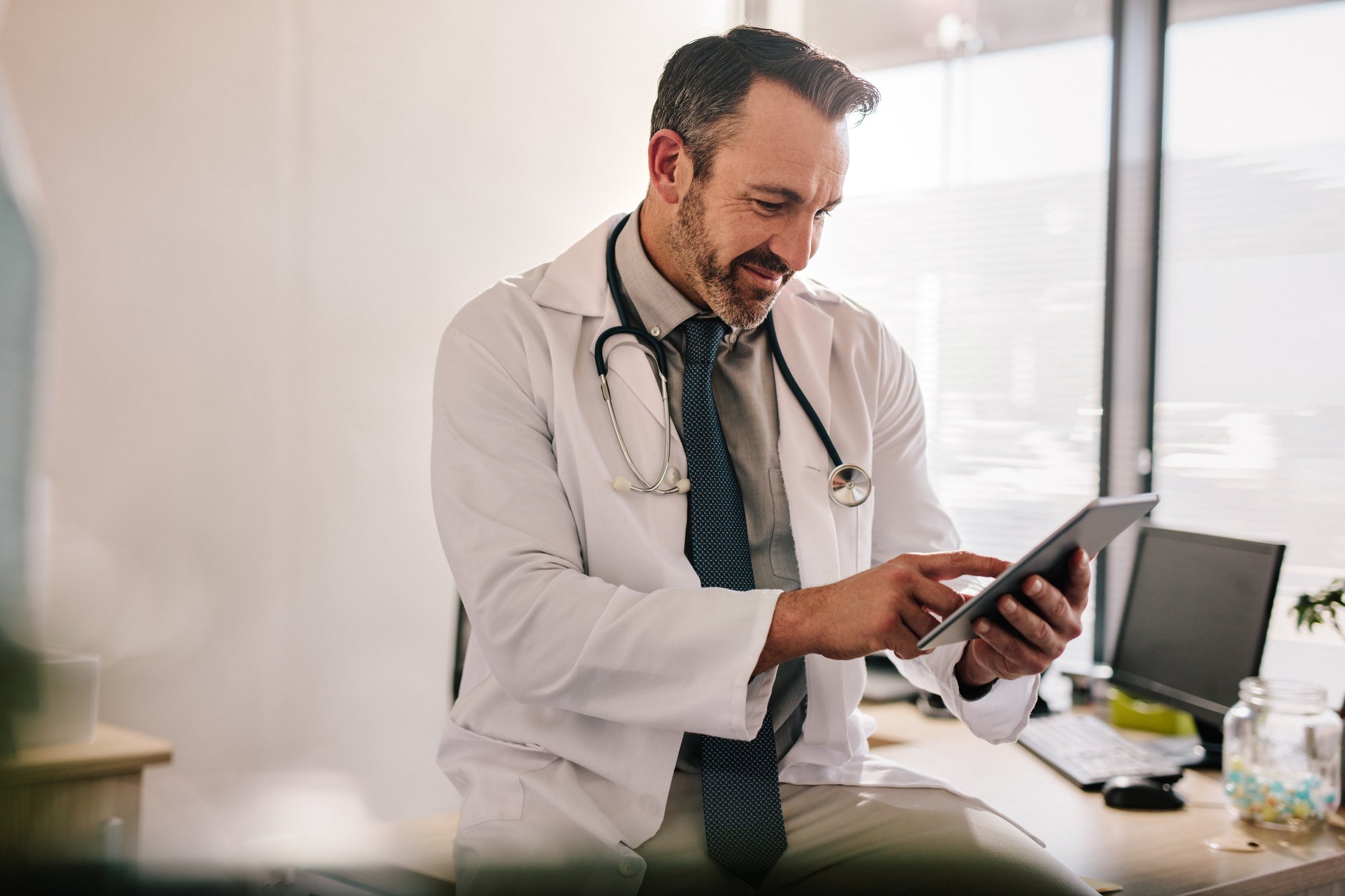 Male doctor on Ipad